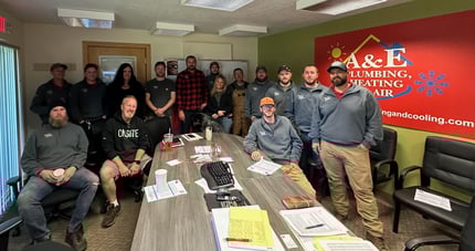 Some of the A&amp;E Plumbing, Heating and Air team in the office after a staff meeting.