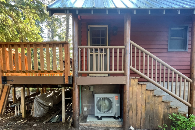 A newly installed outdoor heating and cooling unit under an Oregon porch.