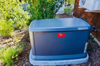 A Honeywell Generator with a red A&E Plumbing, Heating and Air sticker on the front.