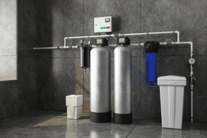 A dual-tank water filtration system sits in the basement of a homeowner.