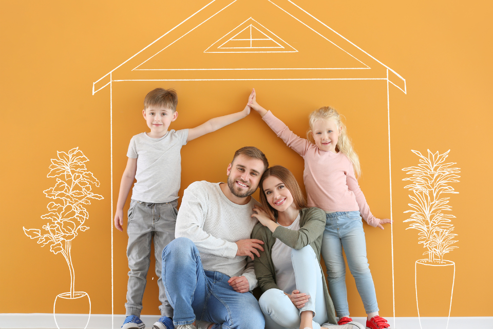 Two children standing overhead their parents, their hands intertwined to represent the roof of their family home.