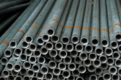A shot of several residential galvanized steel pipes used for indoor plumbing.
