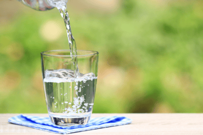 Pouring tap water into a glass