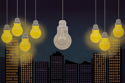 A graphic design of 3 groups of lightbulbs, the middle one being the only one without power with the city underneath also dark.