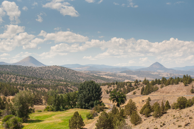 Eastern Oregon foreground with hills and mountains in the background in Rufus, OR